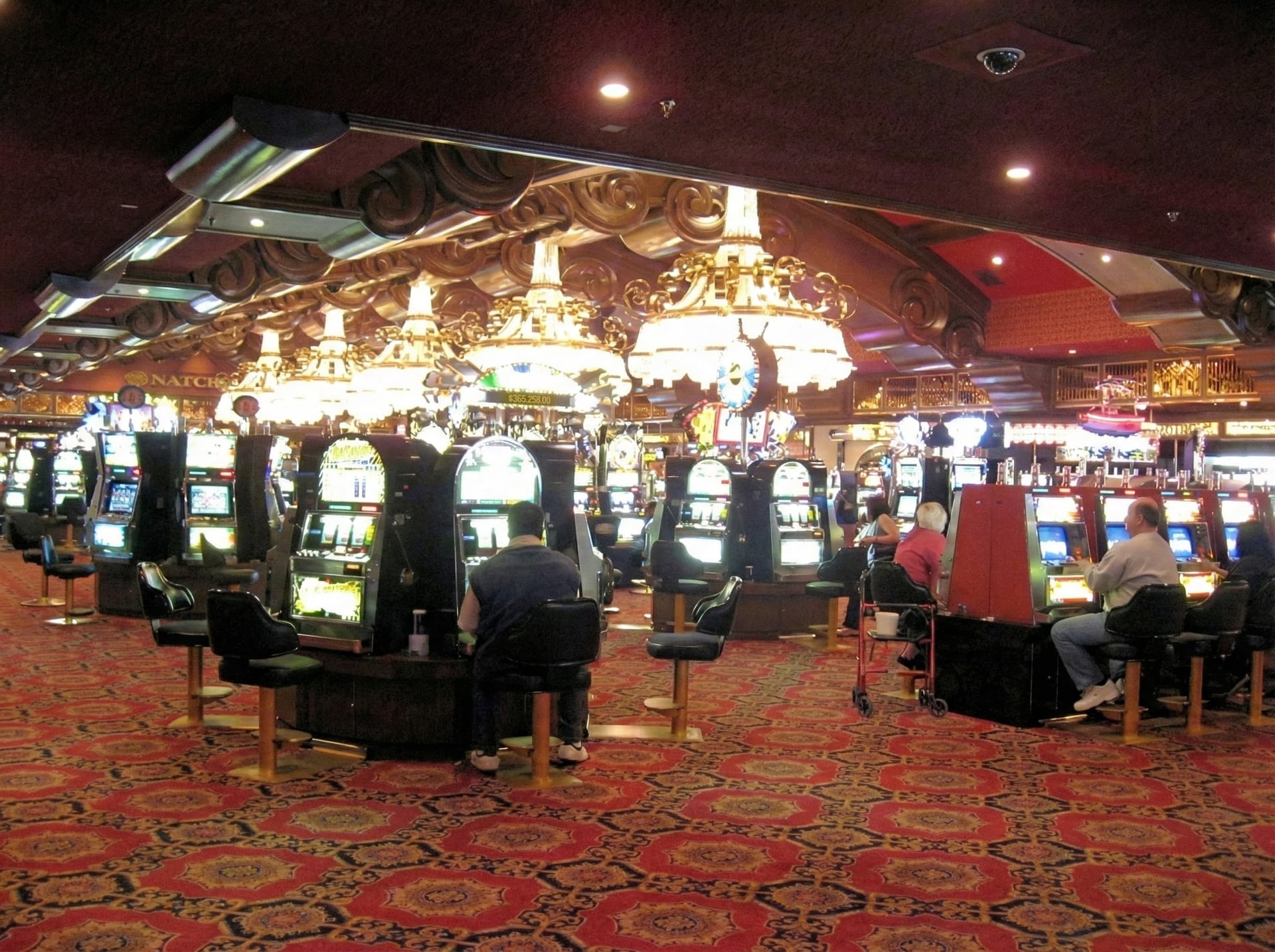 Nevada Landing casino floor with slot machines and elegant chandeliers